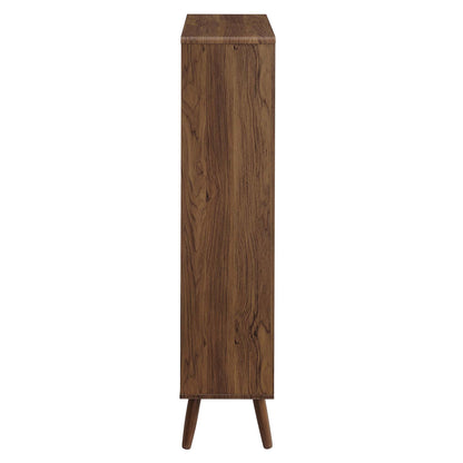 Tall walnut wood grain bookcase with five open shelves on three angled legs in a mid-century modern style.