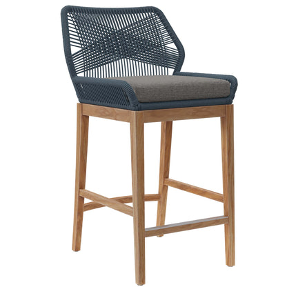 Gray woven back bar stool with light wood legs and a gray cushion.