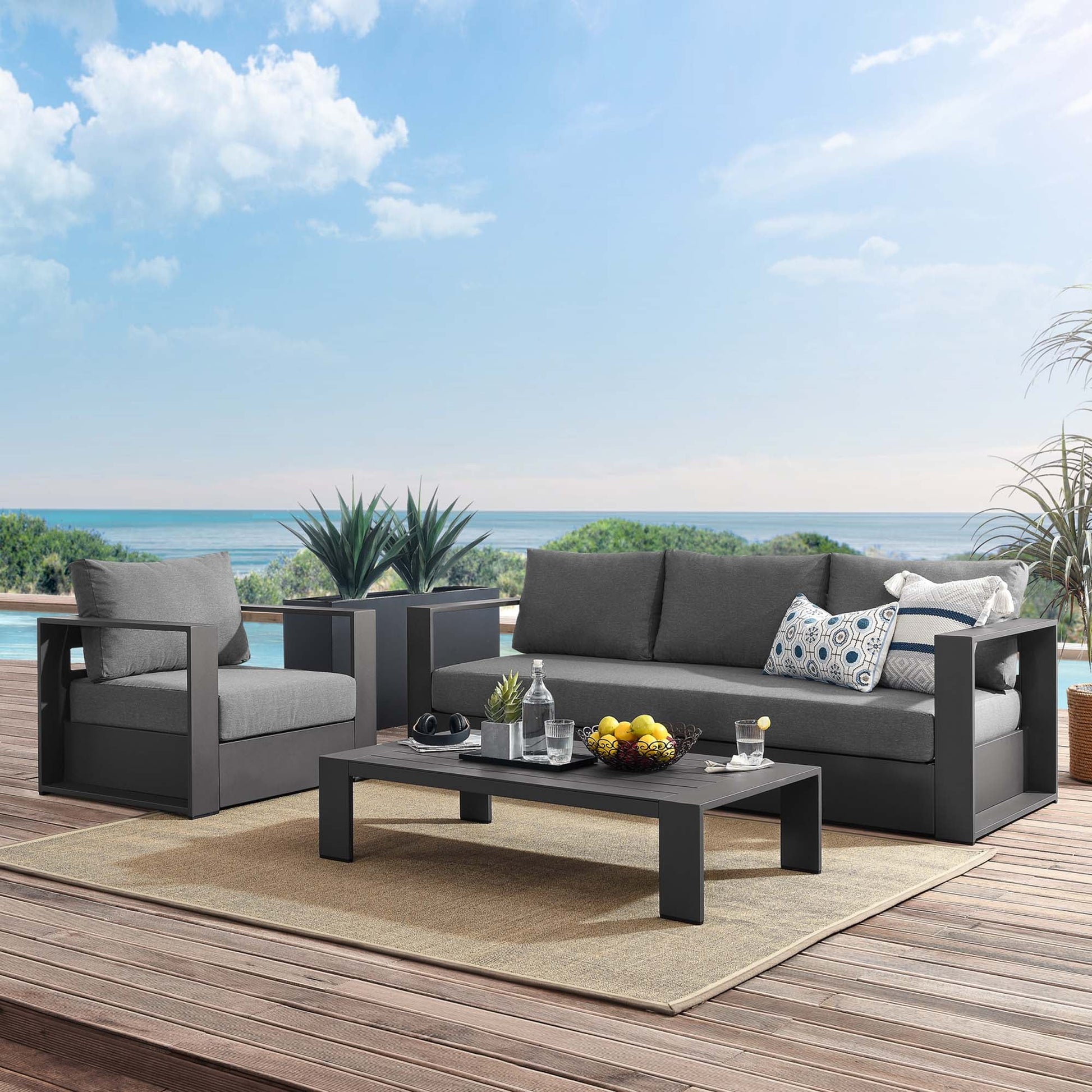 Gray Charcoal Modway Tahoe 3-piece outdoor patio set with powder-coated aluminum frame, sofa, armchair, and coffee table, featuring UV-resistant cushions for modern backyard and deck spaces.