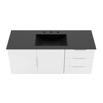 White bathroom vanity with black countertop and rectangular undermount sink; two doors left and three drawers right.