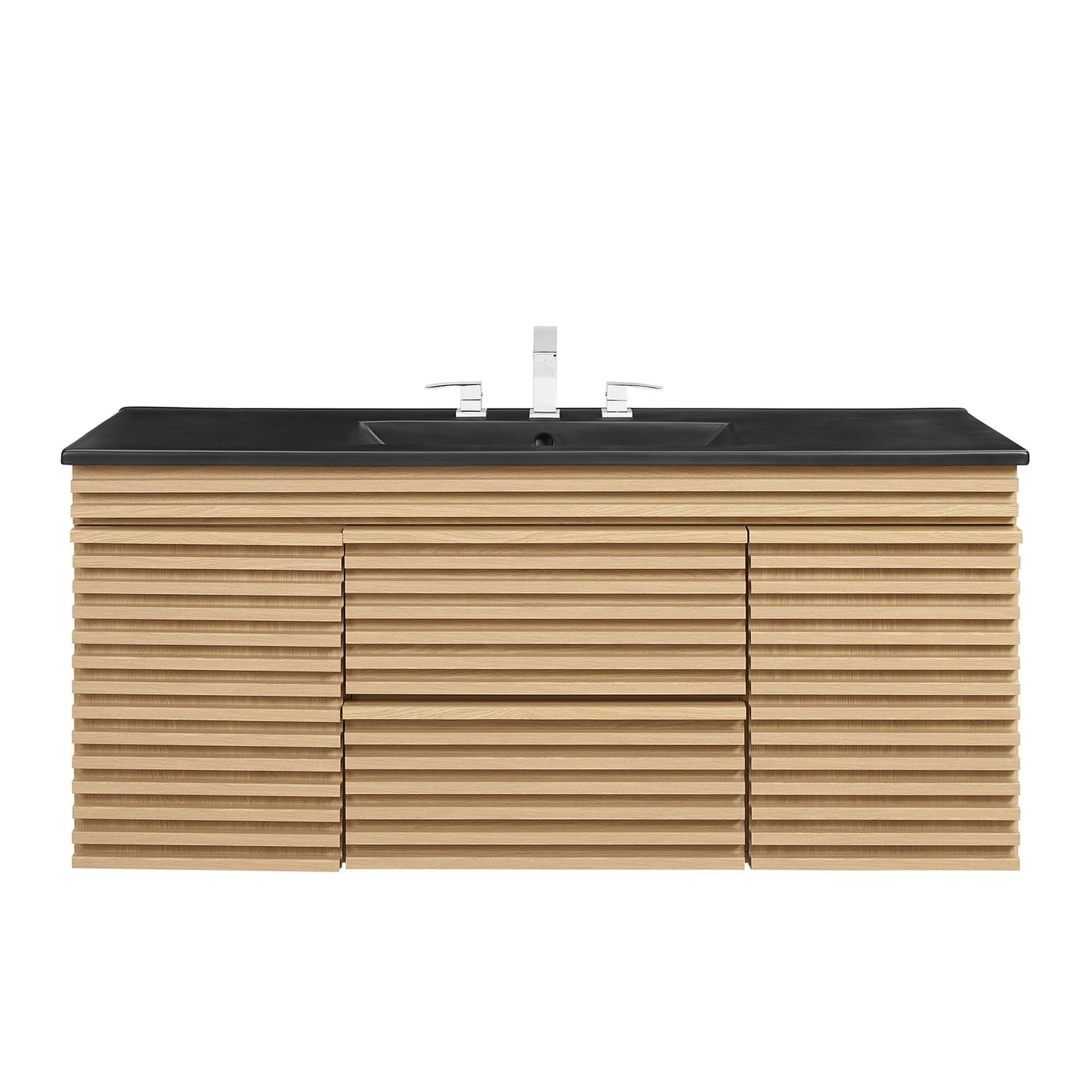 Oak slat-front wall-mount bathroom vanity with black countertop and dual sinks, chrome faucet fixtures.