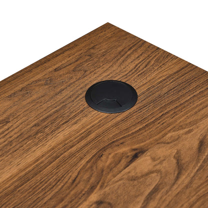 Walnut-finish wood desk top with a black circular cable grommet inset; part of a desk and file cabinet set.