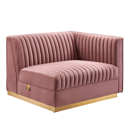 Red velvet tufted modular sectional sofa, L-shaped with vertical channel stitching.