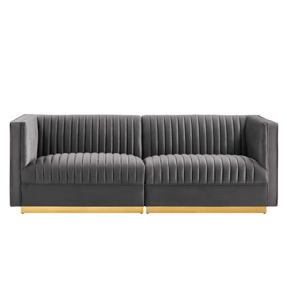 Gray velvet 2-seat sofa with vertical channel tufting, square arms and a light wood base.