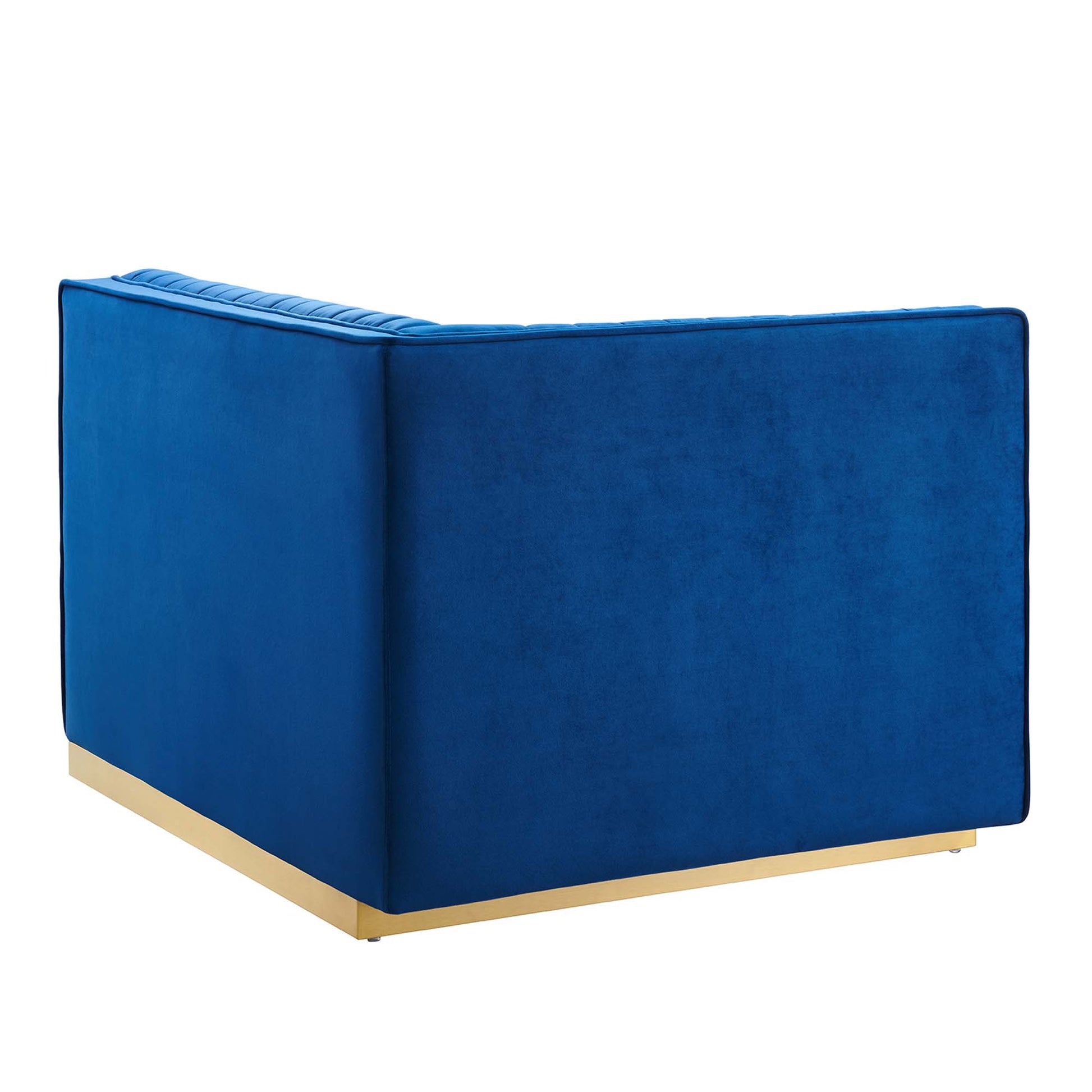 Navy blue velvet modular sectional sofa with boxy shape, square arms, and light wood base.