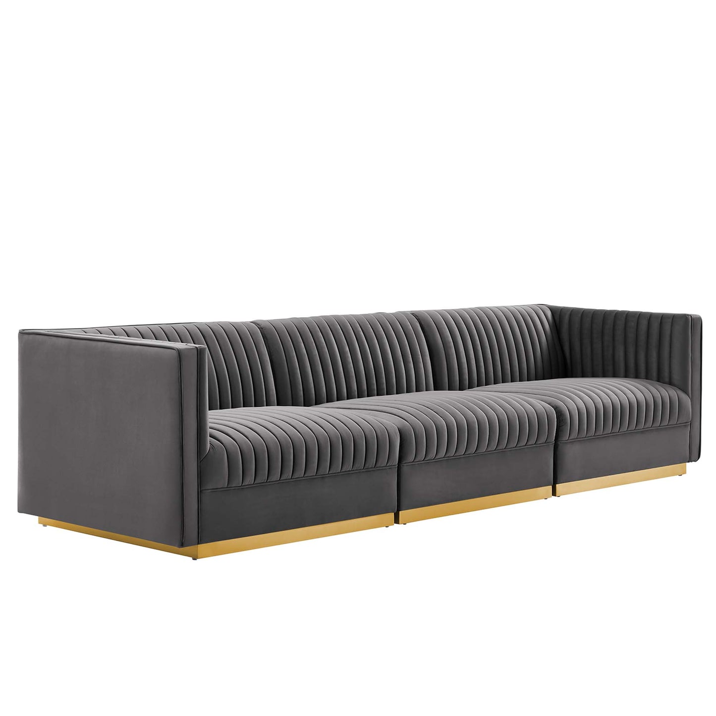 Gray velvet channel-tufted modular sectional sofa with straight arms and a gold-tone wood base.