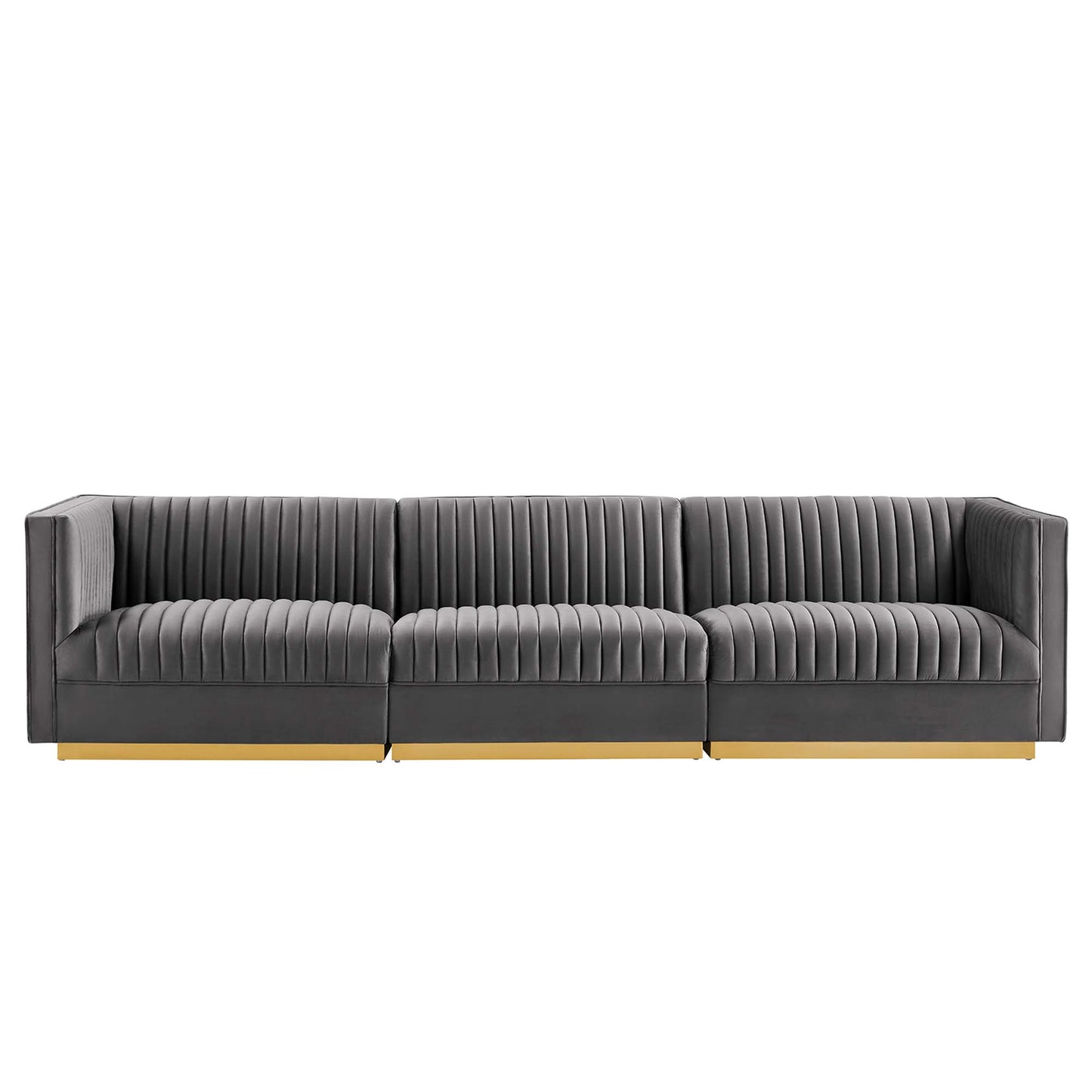 Grey fabric modular sofa with vertical channel tufting, three seats & light wood base.