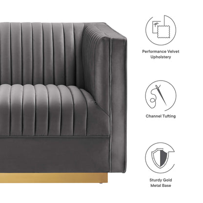 Charcoal gray performance velvet sofa with vertical channel tufting and a gold metal base