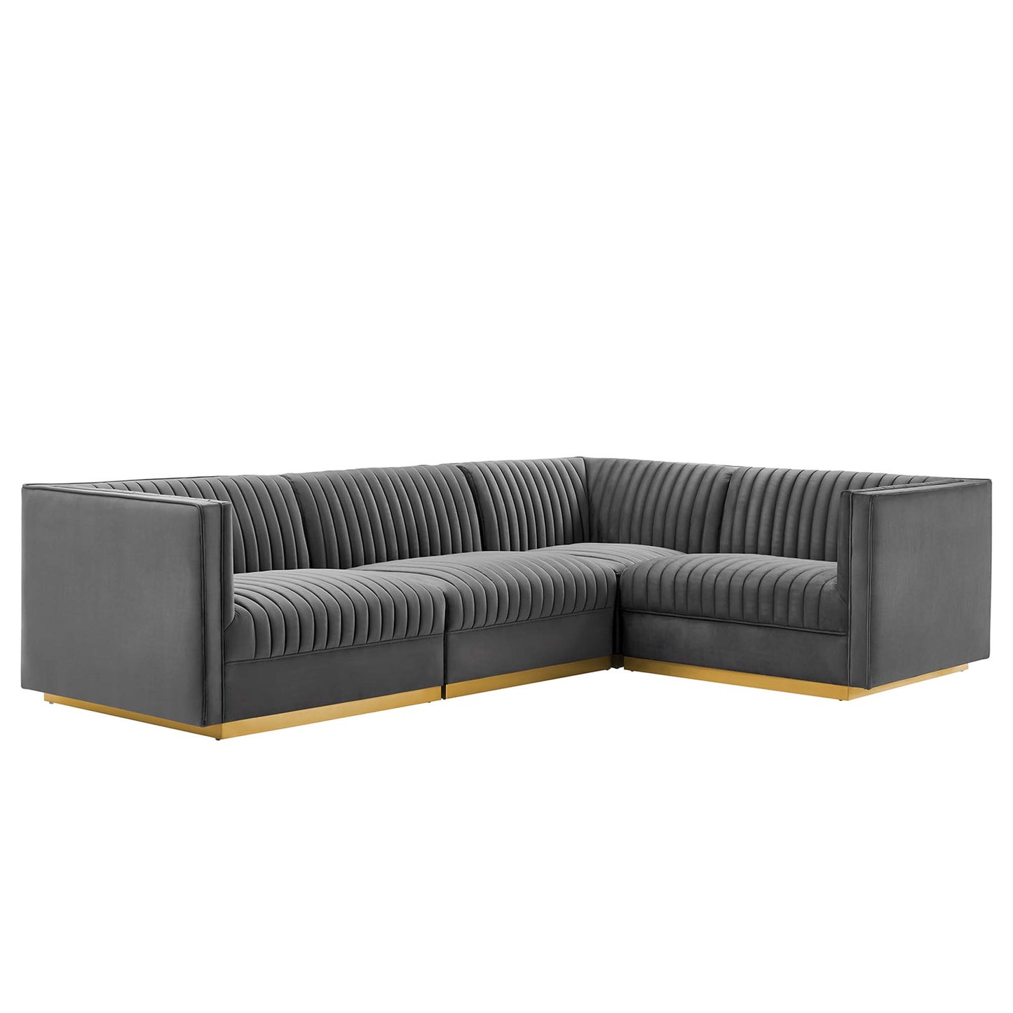 Gray L-shaped sectional sofa with ribbed tufted back and seats, gold-tone wood base, modern contemporary style.