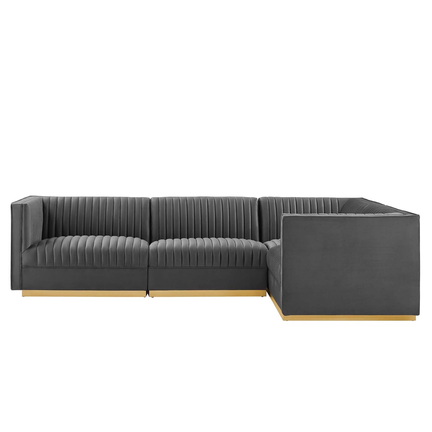 Dark gray velvet sectional with vertical channel tufting, right-facing L-shaped with chaise, light wood legs.