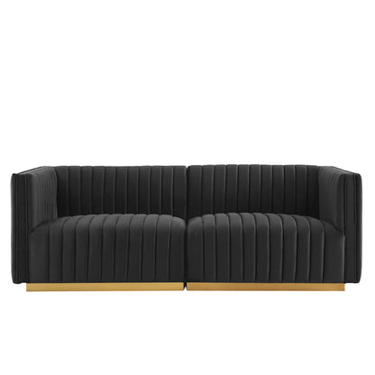 Black velvet loveseat with vertical channel tufting and a gold-tone base, two-seat.