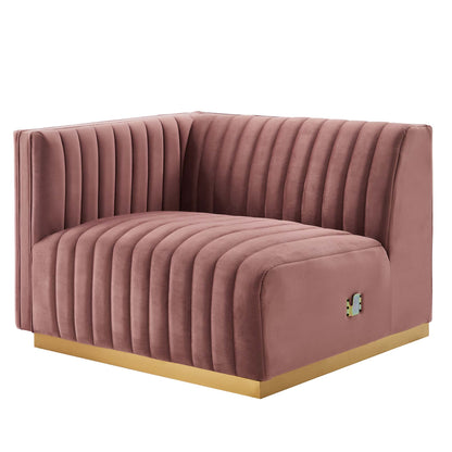 Pink velvet loveseat with vertical channel tufting & a gold-tone base, modern lounge seating.
