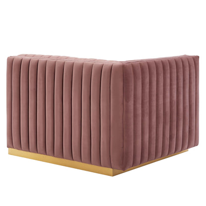 Dusty rose velvet channel-tufted loveseat with a gold-tone metal base.