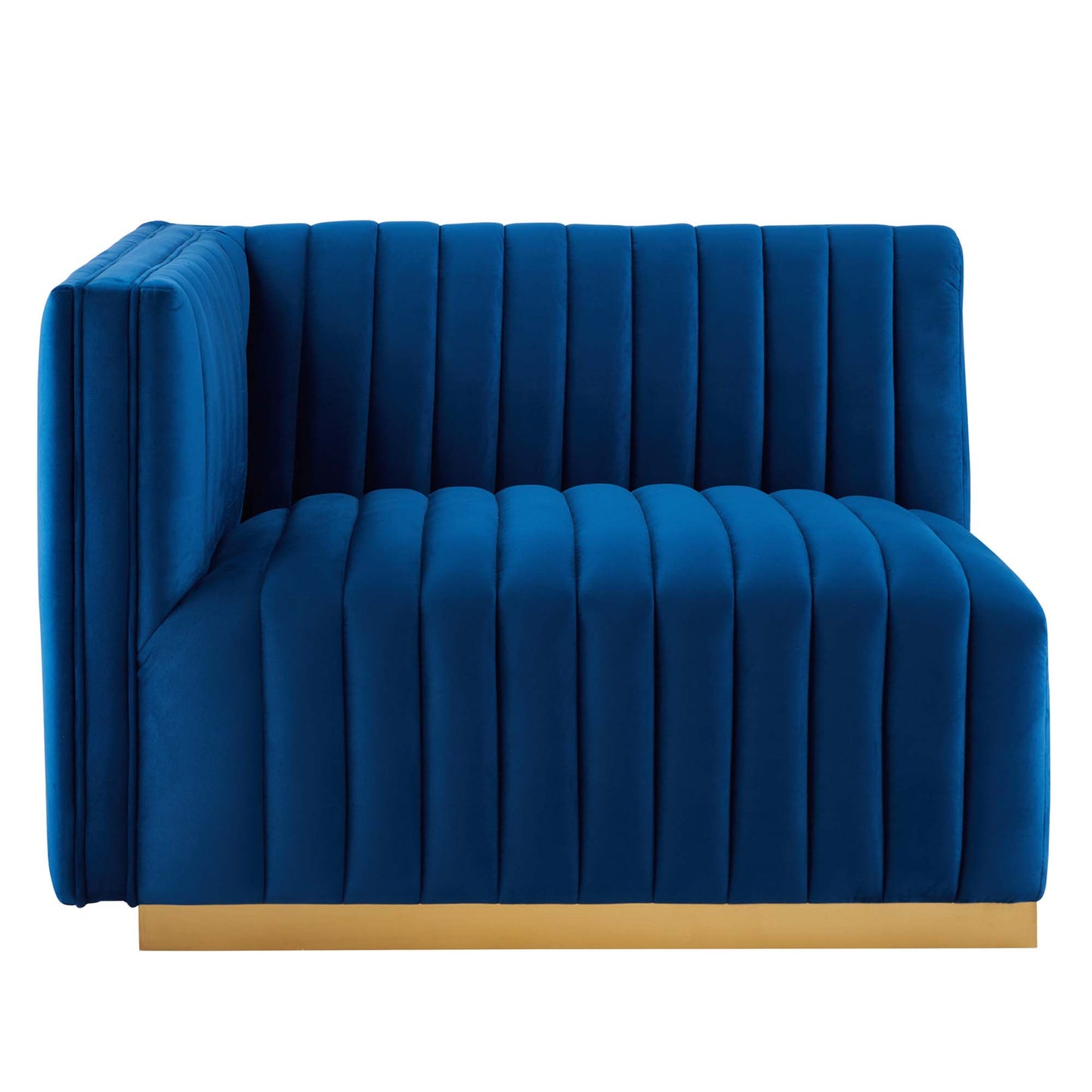 Navy velvet channel-tufted loveseat with a gold base plinth, contemporary lounge seating.