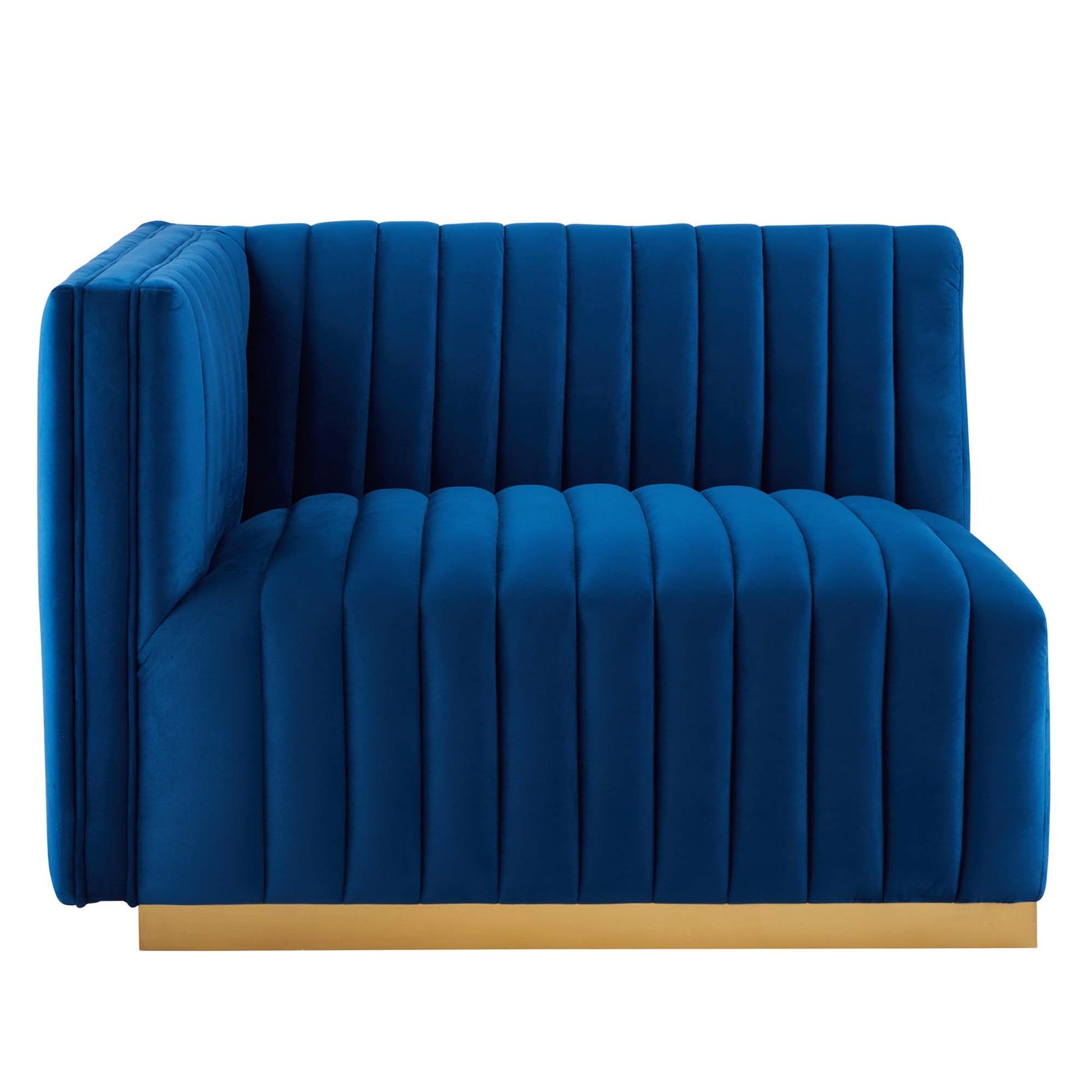 Navy velvet channel-tufted loveseat with a gold base plinth, contemporary lounge seating.