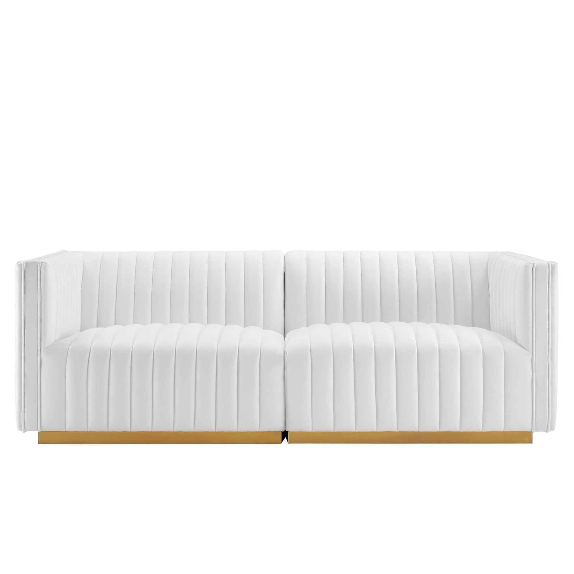 White tufted two-seat loveseat with vertical channel stitching and a gold base rail.