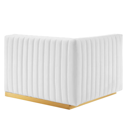 White velvet loveseat with vertical channel tufting and a slim gold base.