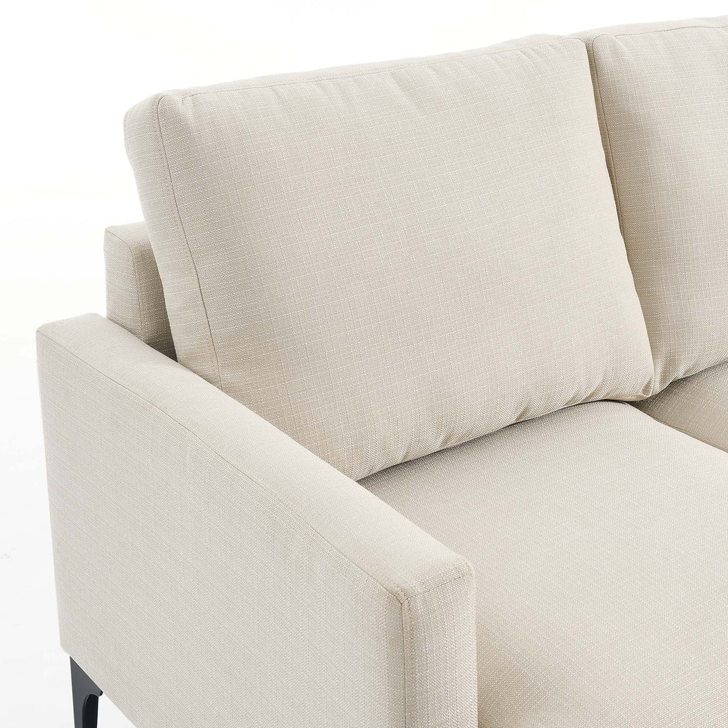 Beige upholstered fabric sectional sofa with right-facing configuration, clean lines, rectangular arms, and two back cushions; modern neutral living room seating.