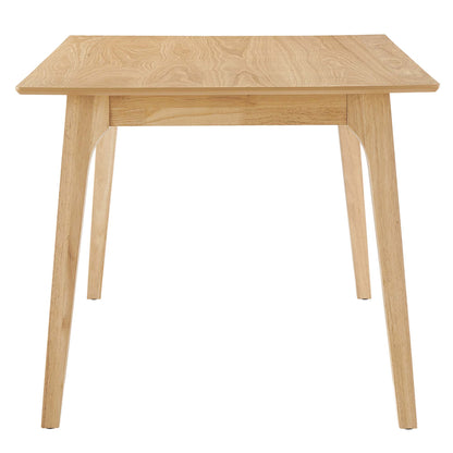 Natural oak dining table with rectangular top and tapered legs in a mid-century modern style.