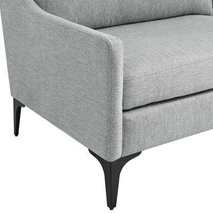Grey fabric upholstered sofa with curved arms, plush cushions, and black tapered legs.