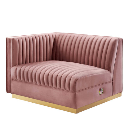 Dusty rose velvet modular sectional sofa with vertical channel tufting and a gold-tone metal base, including a left-arm chair.