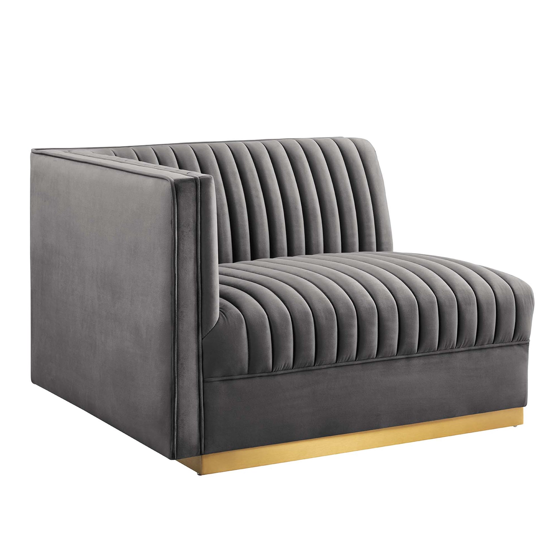 Gray velvet left-arm chair for a modular sectional, with vertical channel tufting, square arms, and a gold metal base.
