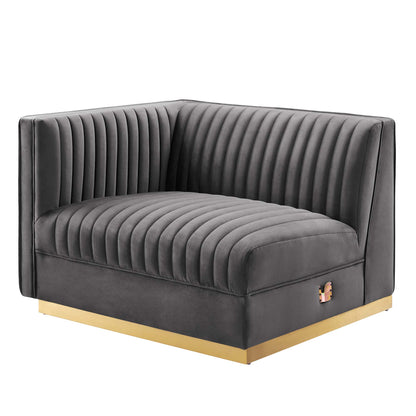 Dark gray velvet left-arm chair with vertical channel tufting and a gold base.