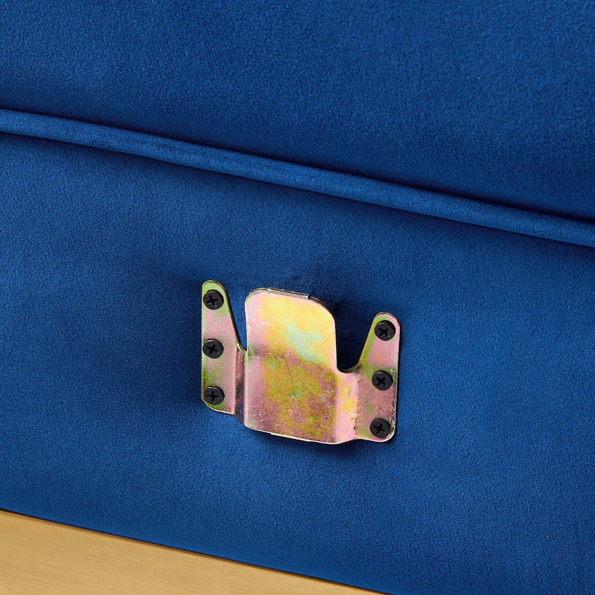 Navy blue performance velvet left-arm chair with channel-tufted cushions, part of a modular sectional sofa.