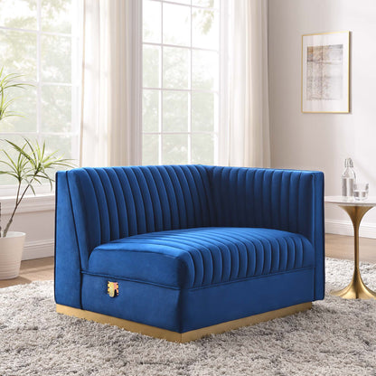 Royal blue velvet modular sectional sofa with vertical channel tufting and gold base, right-arm chair component in modern living room style.