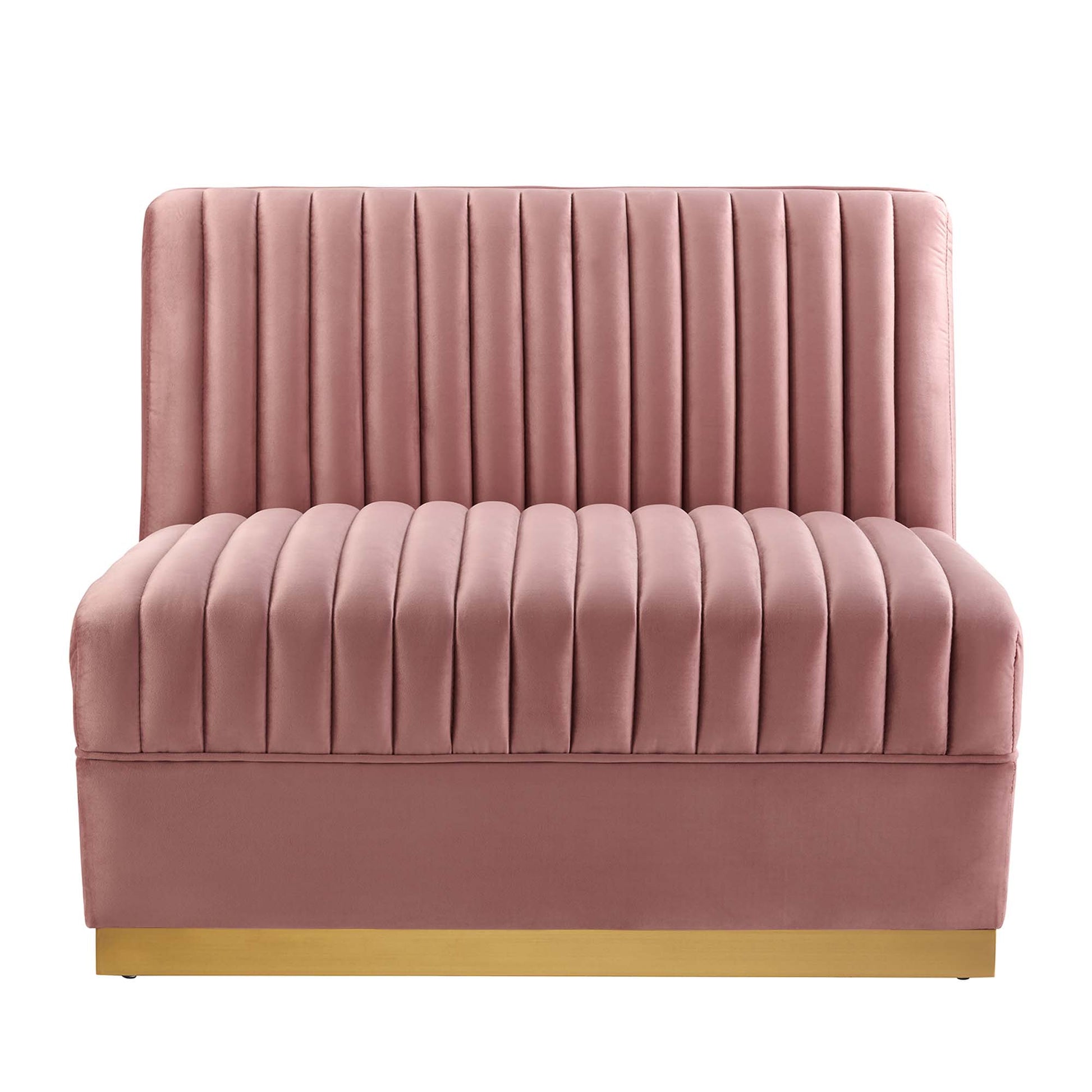 Red velvet channel-tufted armless chair, part of a modular sectional sofa, with a tall back and gold-tone base.