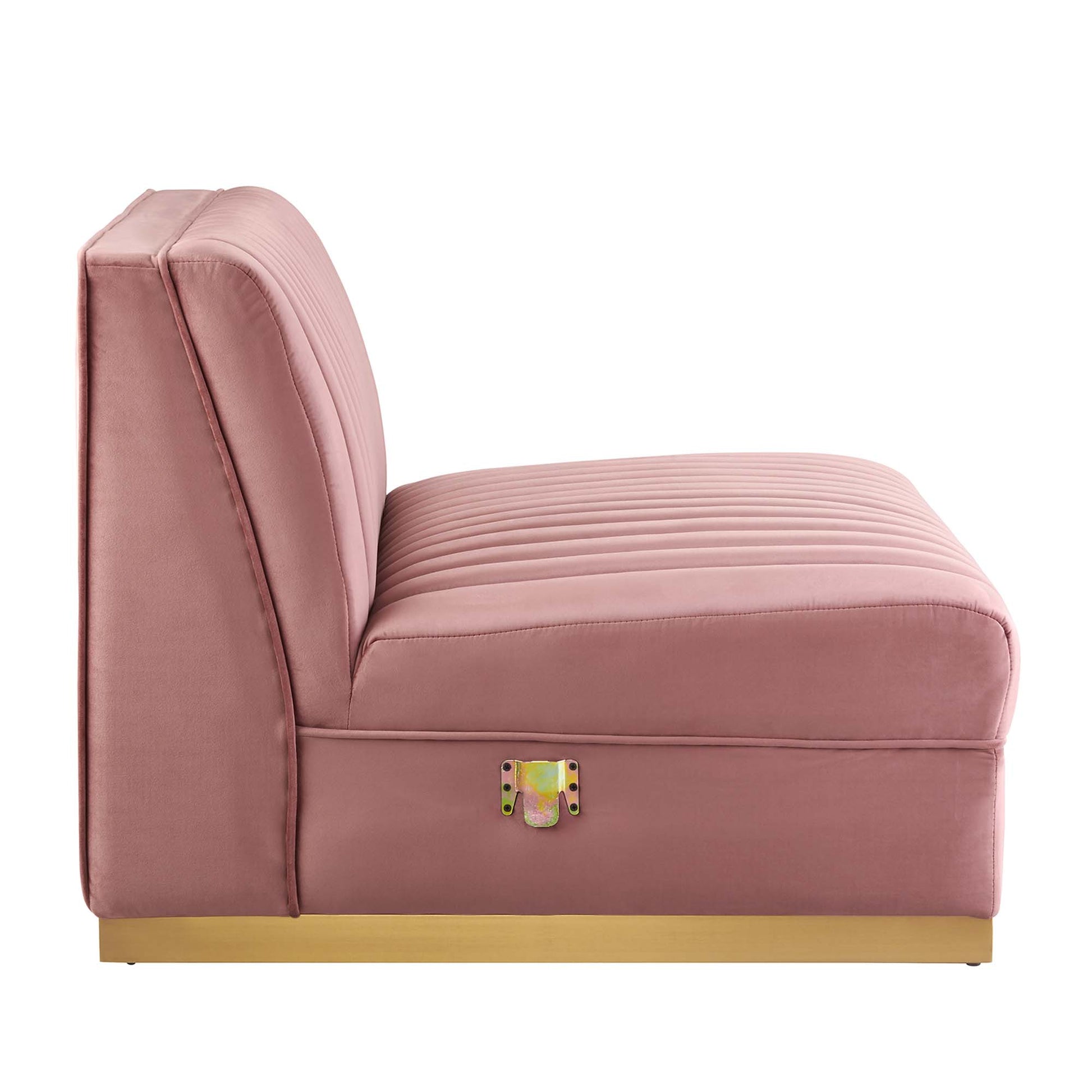 Red velvet armless chair with channel tufting and ribbed seat cushion on a low gold base.