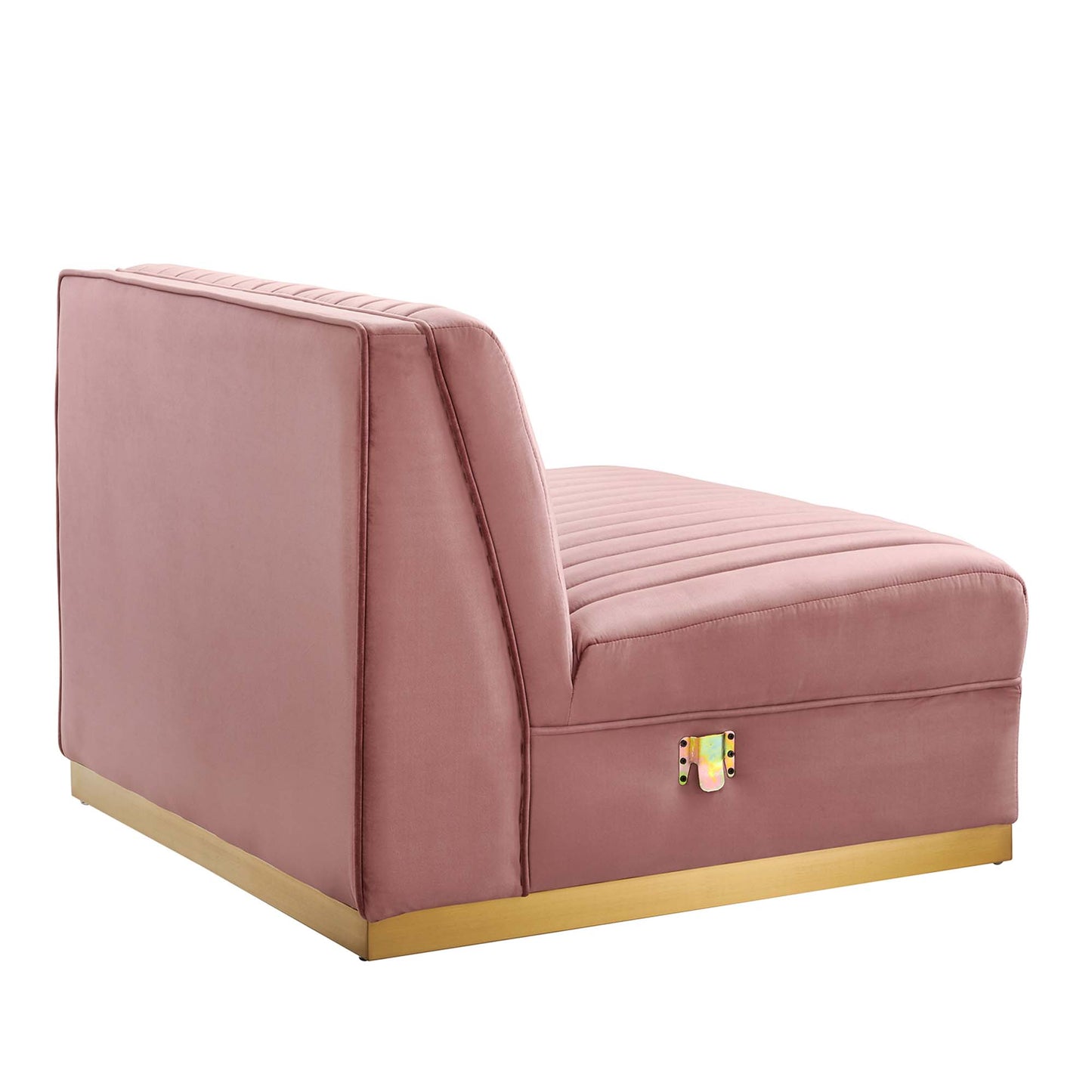 Red velvet armless chair with channel tufting, part of a modular sectional sofa