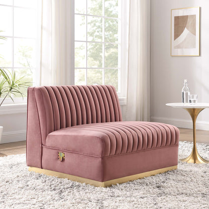 Red velvet channel-tufted armless chair with a curved silhouette & gold base in a bright, airy living room.