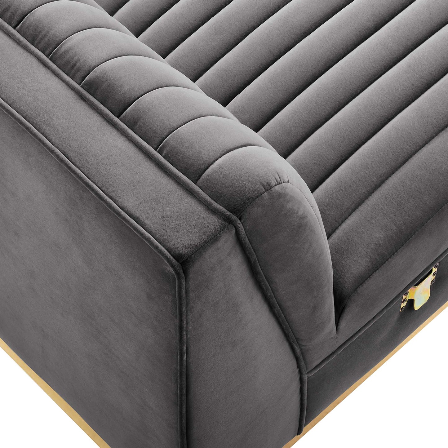 Gray velvet armless chair with channel-tufted upholstery, from a modular sectional sofa.