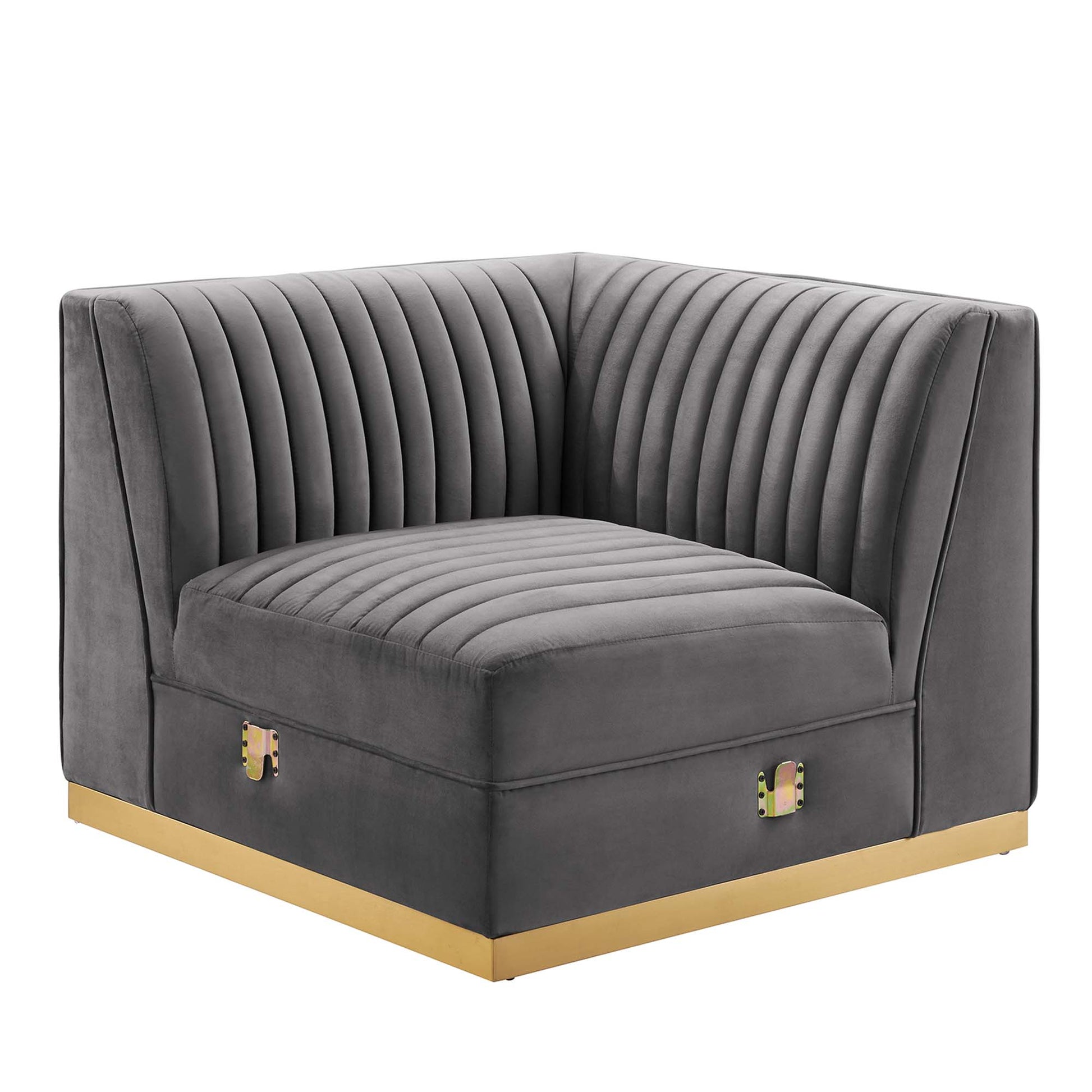 Gray velvet corner chair with vertical channel tufting, square arms, and gold base trim.