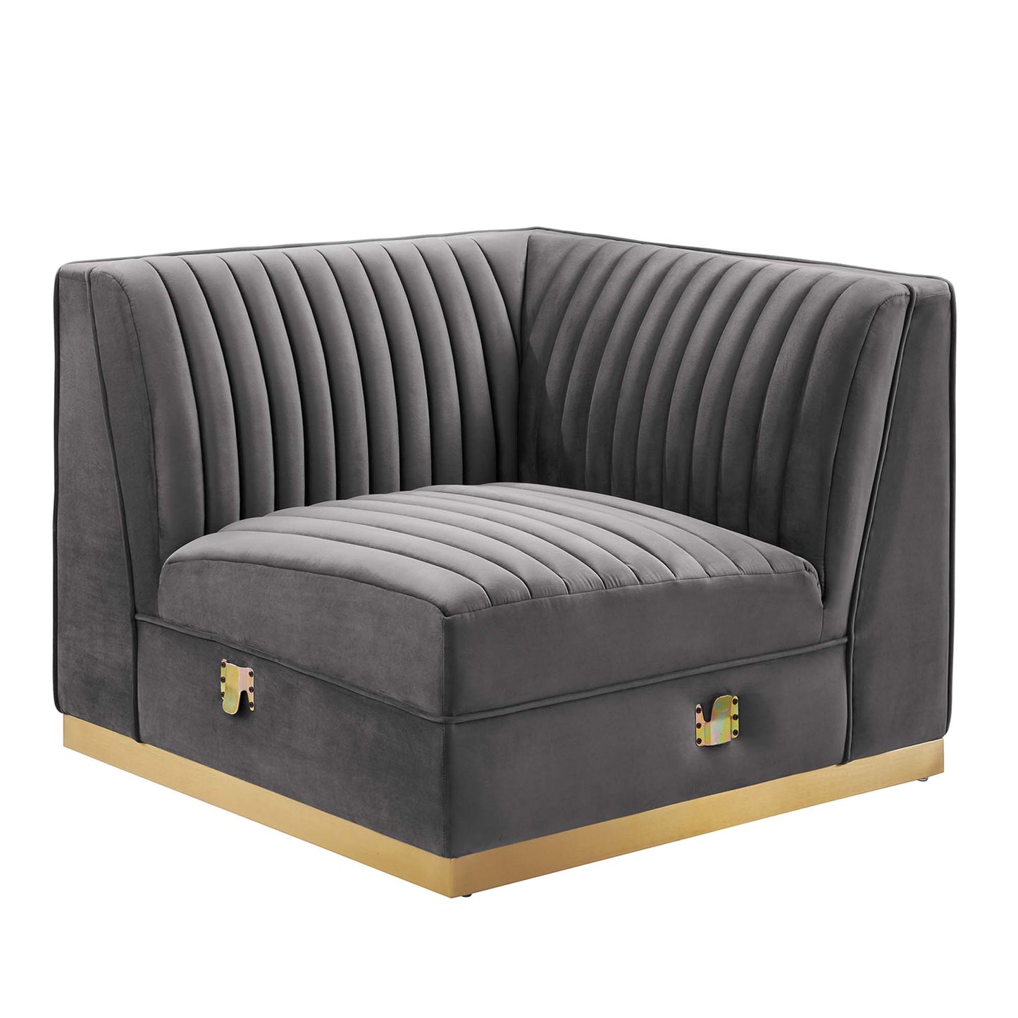 Gray velvet corner chair with vertical channel tufting, curved back and gold base.