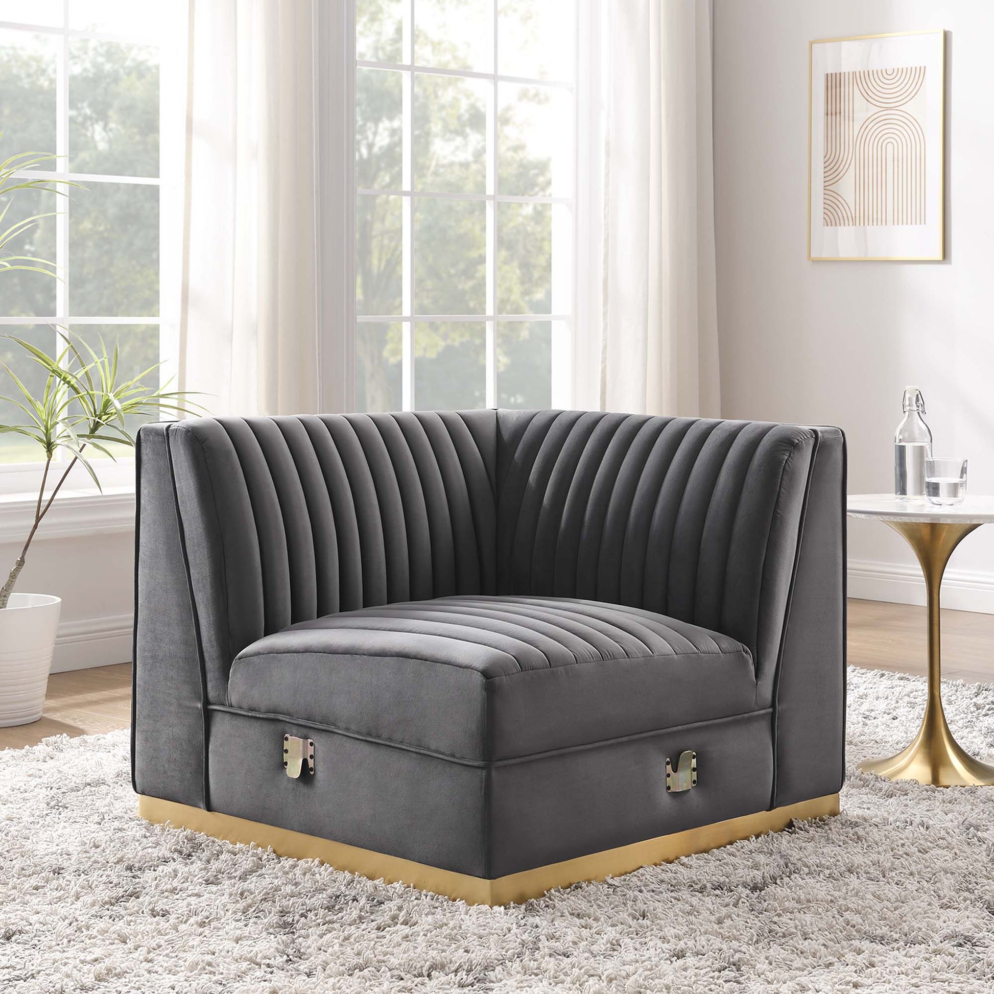 Gray velvet channel-tufted modular sectional right-corner chair with curved back and arms.