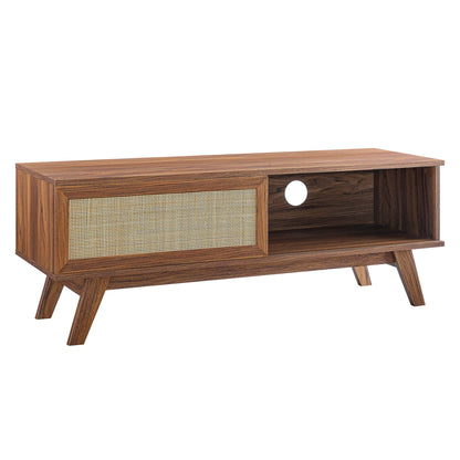 Walnut finish mid-century TV stand with woven cane door, open shelf with circular cable hole, angled tapered legs.