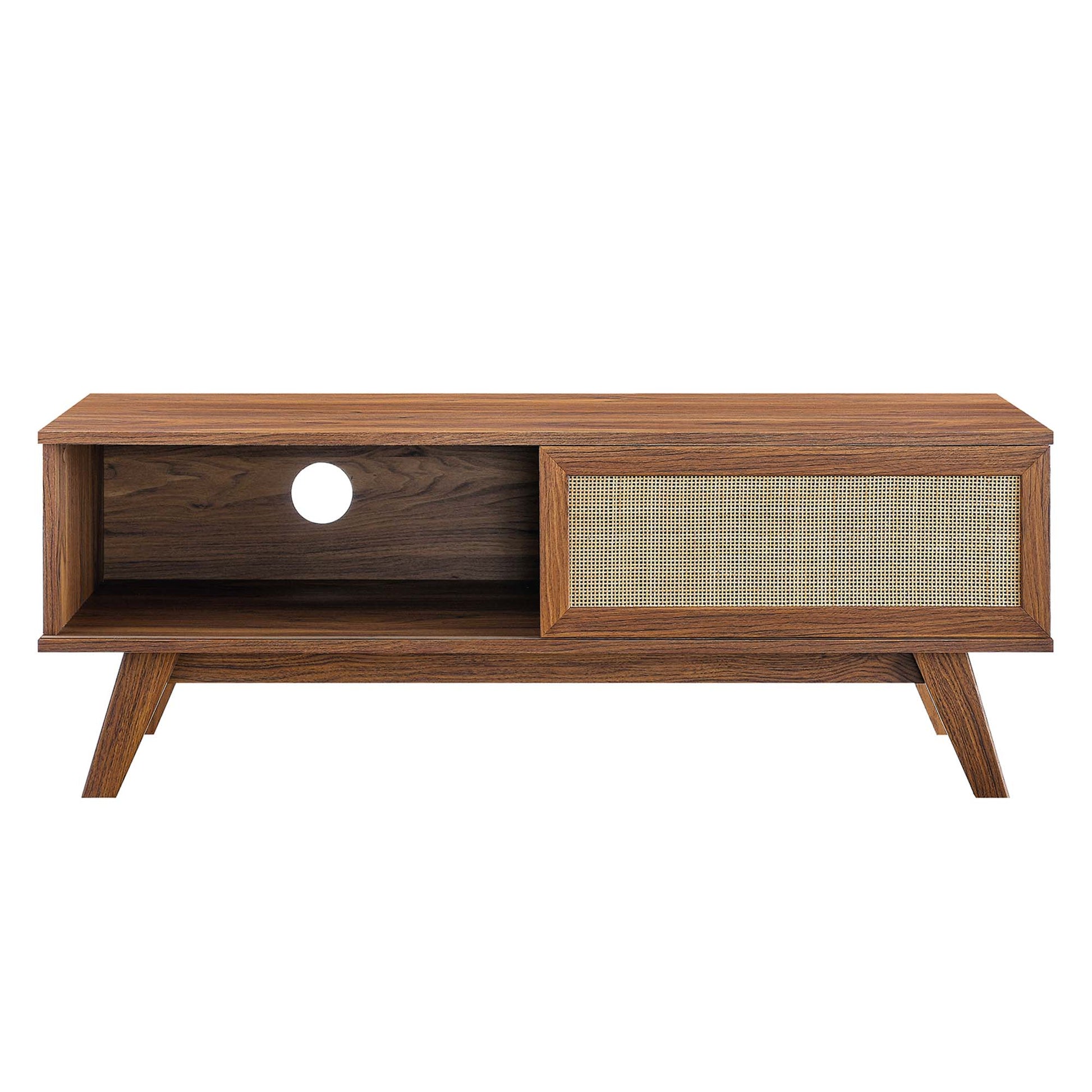 Walnut mid-century modern media console with open left shelf (cable hole) and right woven cane panel, angled legs.