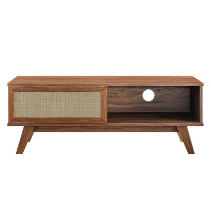 Walnut mid-century TV stand with a woven rattan door on left and an open right compartment with a cable hole, angled legs.