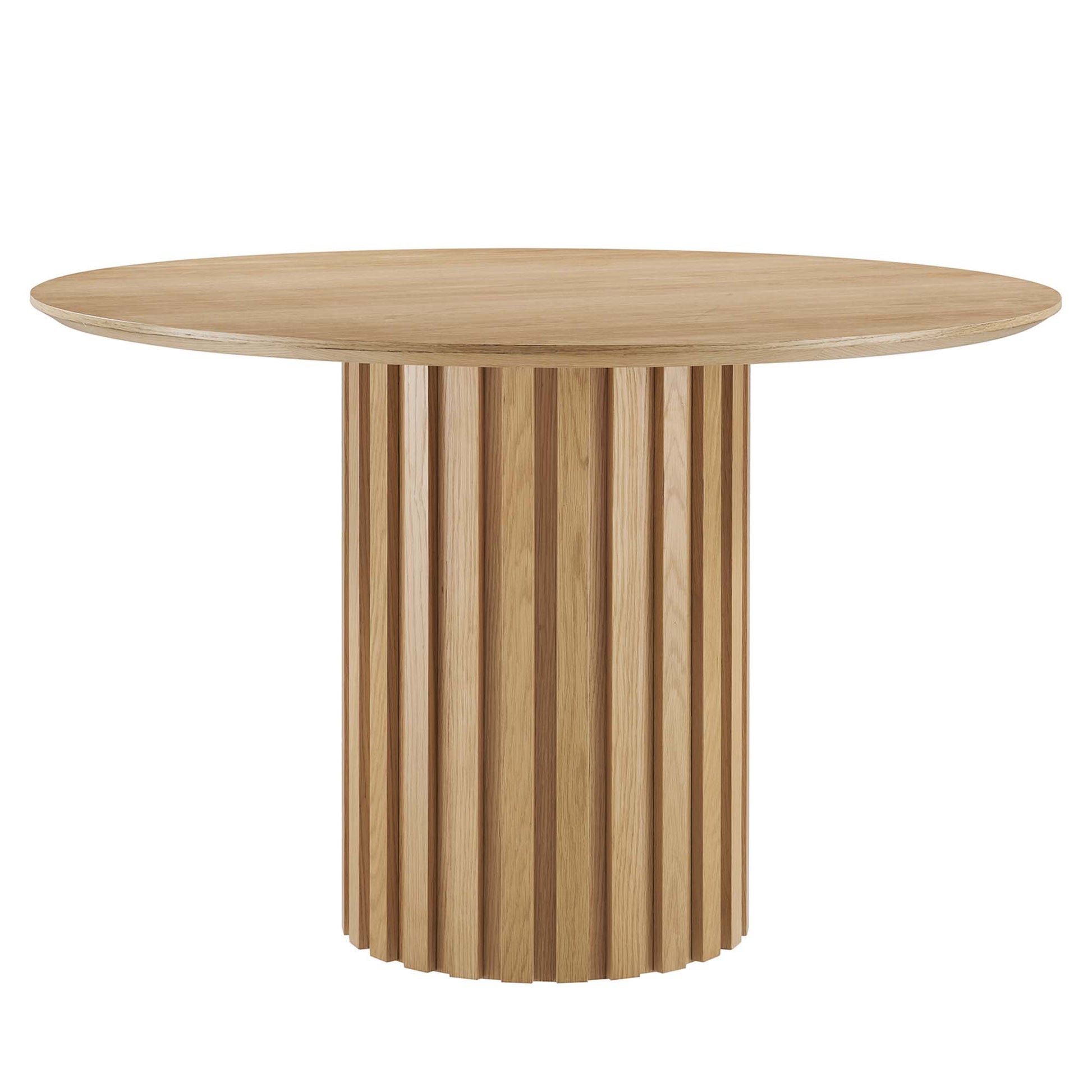 Oak round dining table with a cylindrical pedestal base made of vertical slats.