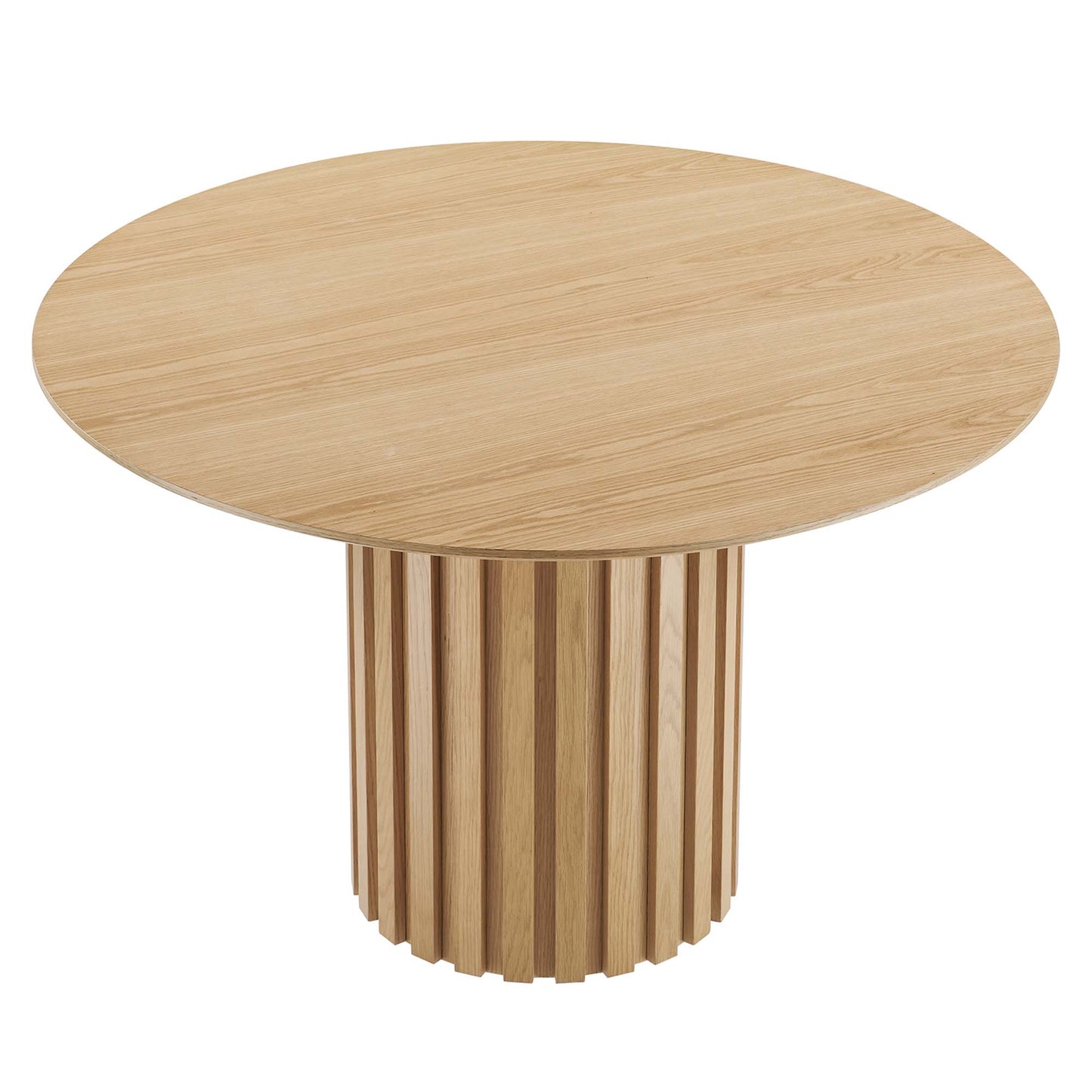 Round oak dining table with natural finish and a vertical slat drum pedestal.