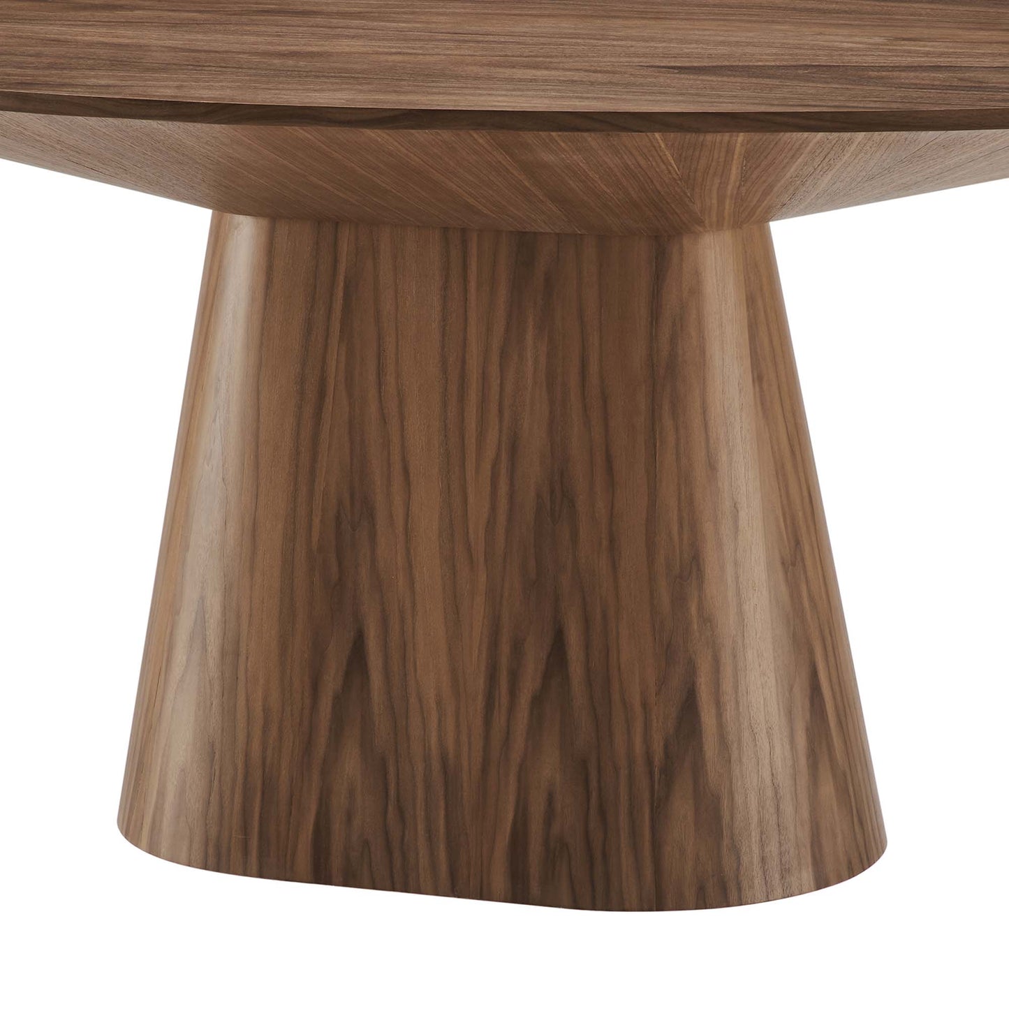Walnut wood oval dining table with a single tapered pedestal base and prominent grain.