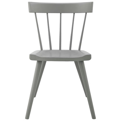 Gray-painted wooden dining chairs with spindle backs, curved seats and tapered legs.