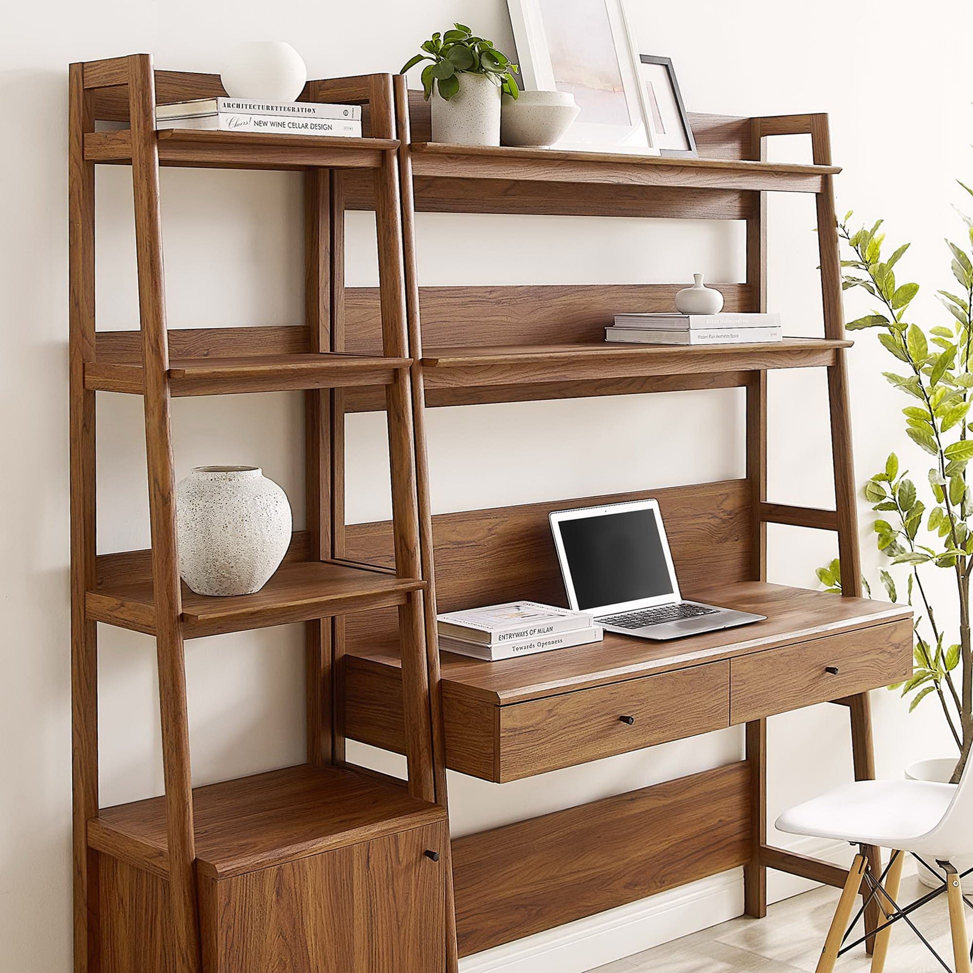 Walnut desk and bookshelf two-piece set; desk with built-in storage drawers and shelves, laptop on desk, modern home office.