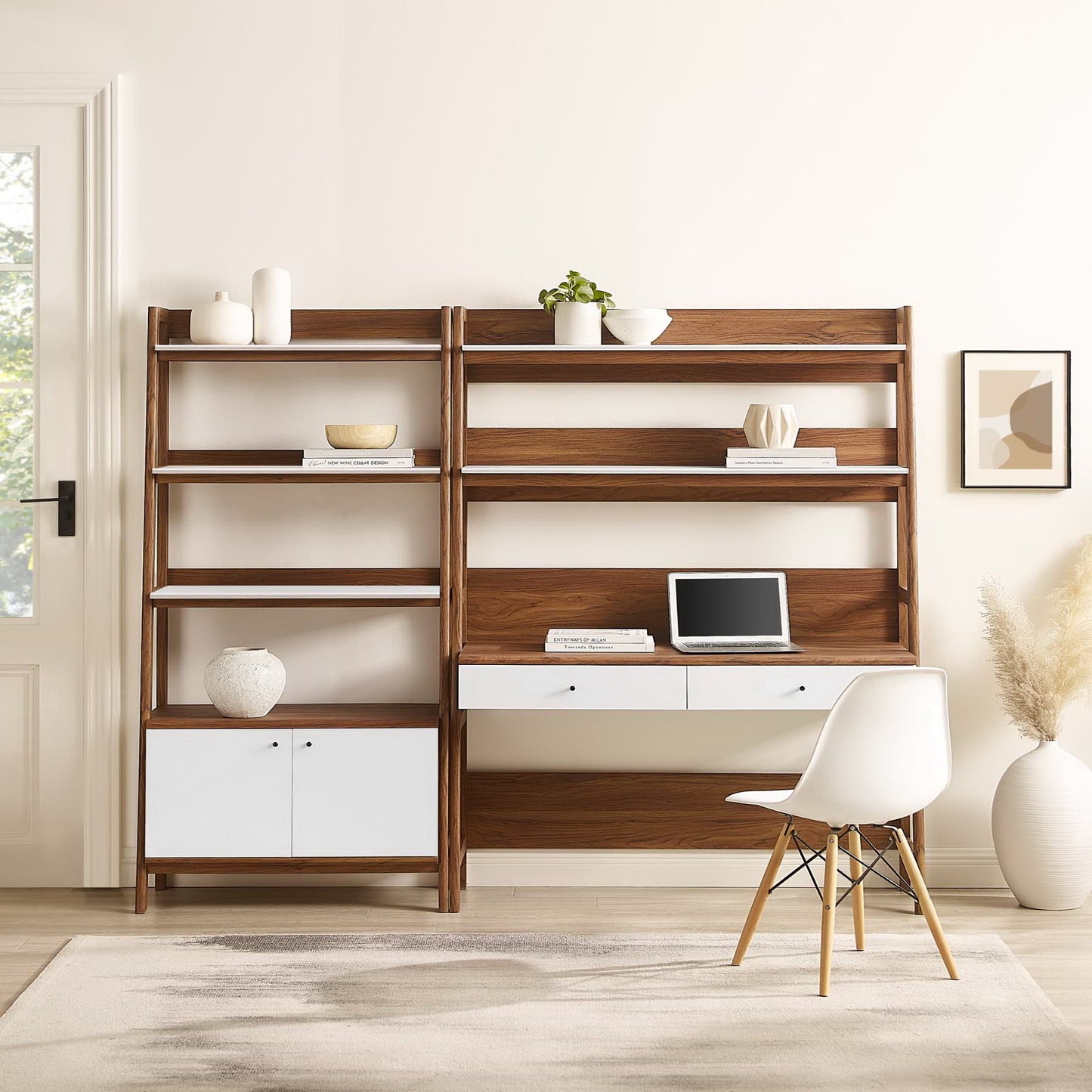 Walnut and white wood office desk and bookshelf with open shelves and drawers, a laptop on the desk.