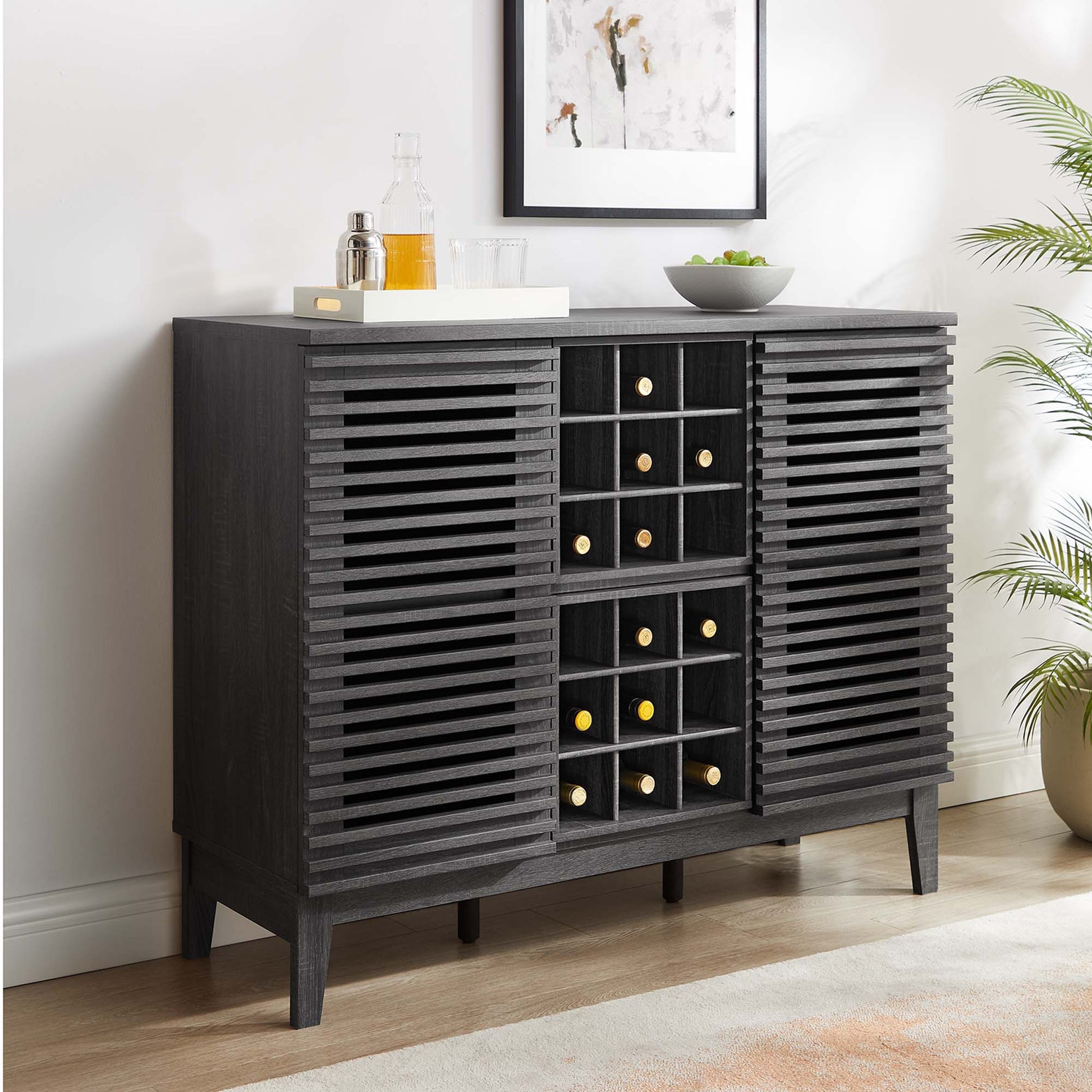 Brown bar cabinet with louvered doors and a central wine rack; mid-century modern design with a top tray for bottle, glassware and a bowl.