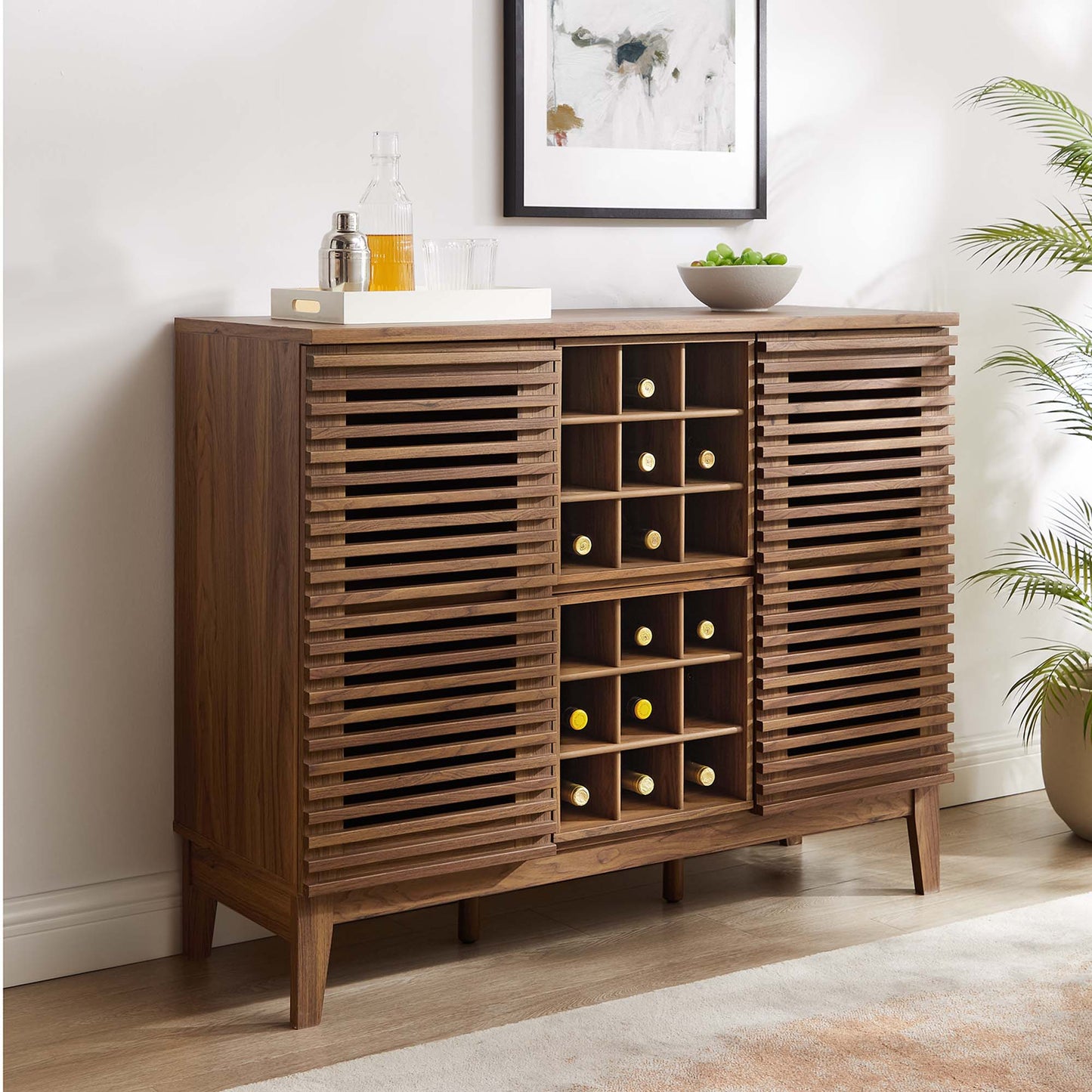 Walnut bar cabinet in mid-century style with slatted doors and a central 12-bottle wine rack, tapered legs.