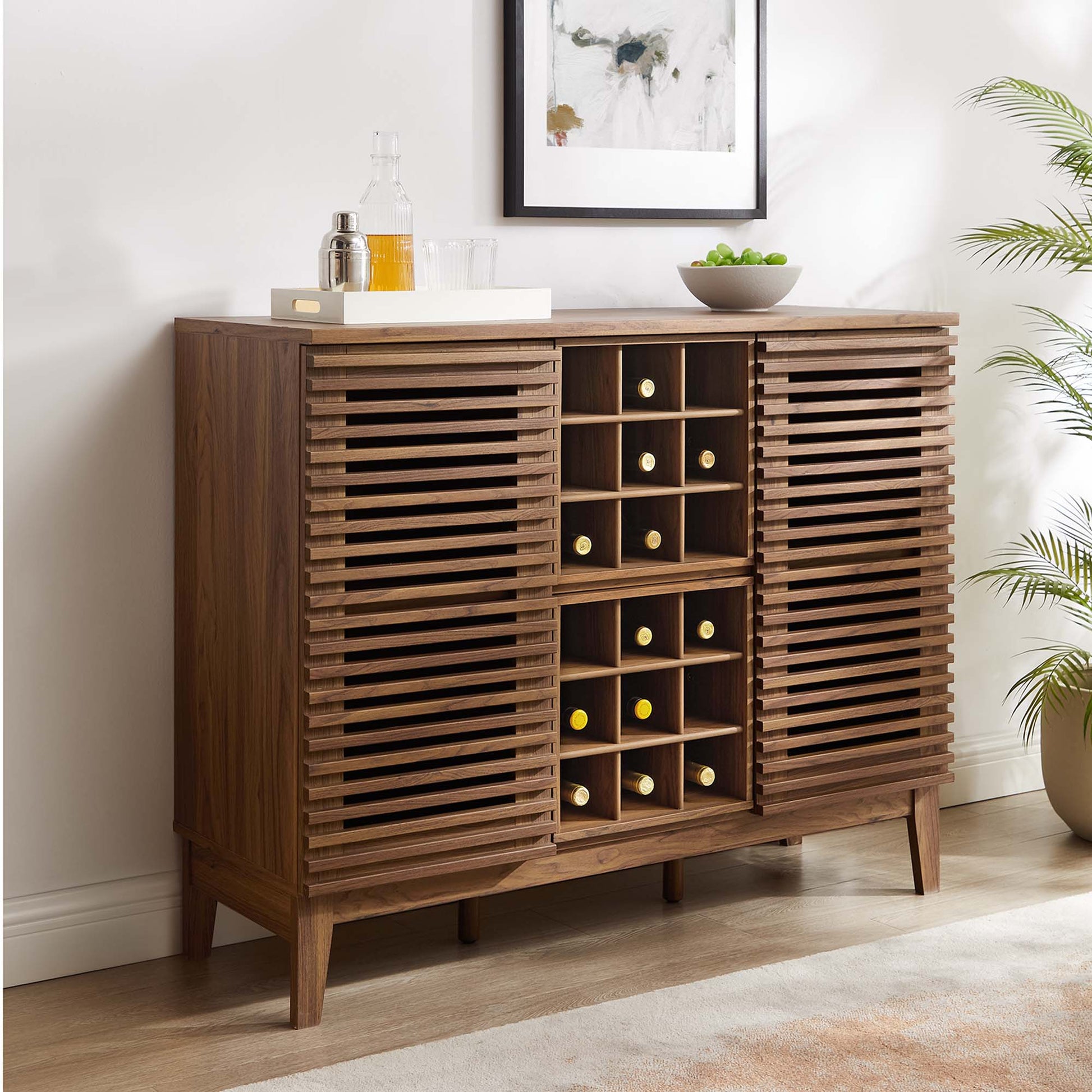 Walnut bar cabinet in mid-century style with slatted doors and a central 12-bottle wine rack, tapered legs.