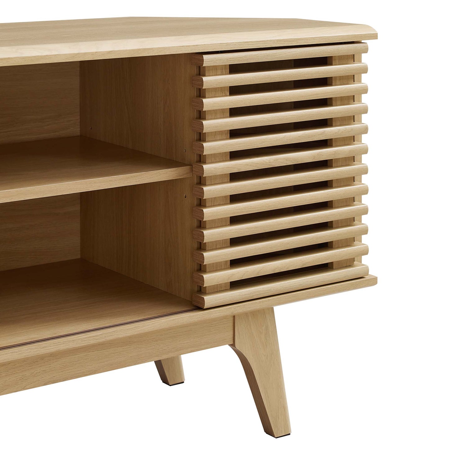 Natural oak wood corner TV stand with slatted door and open shelves, angled legs.
